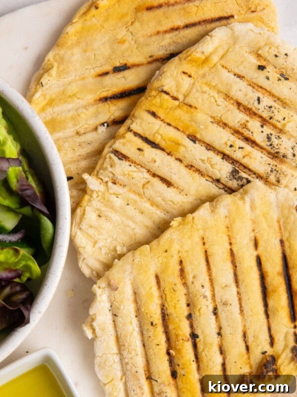 Creamy Vegan Tzatziki Sauce Recipe for Mediterranean Dishes 8 3 gluten free flatbreads on white plate.