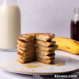Fluffy Banana Oat Pancakes Recipe for Quick Morning Meals 12 Banana Oat Pancakes served on a plate.