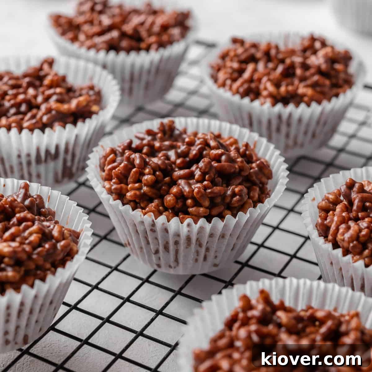 No-Bake Rice Krispie Treat Cakes Recipe for Parties and Gifts 2 rice crispy cakes on a cooling rack.