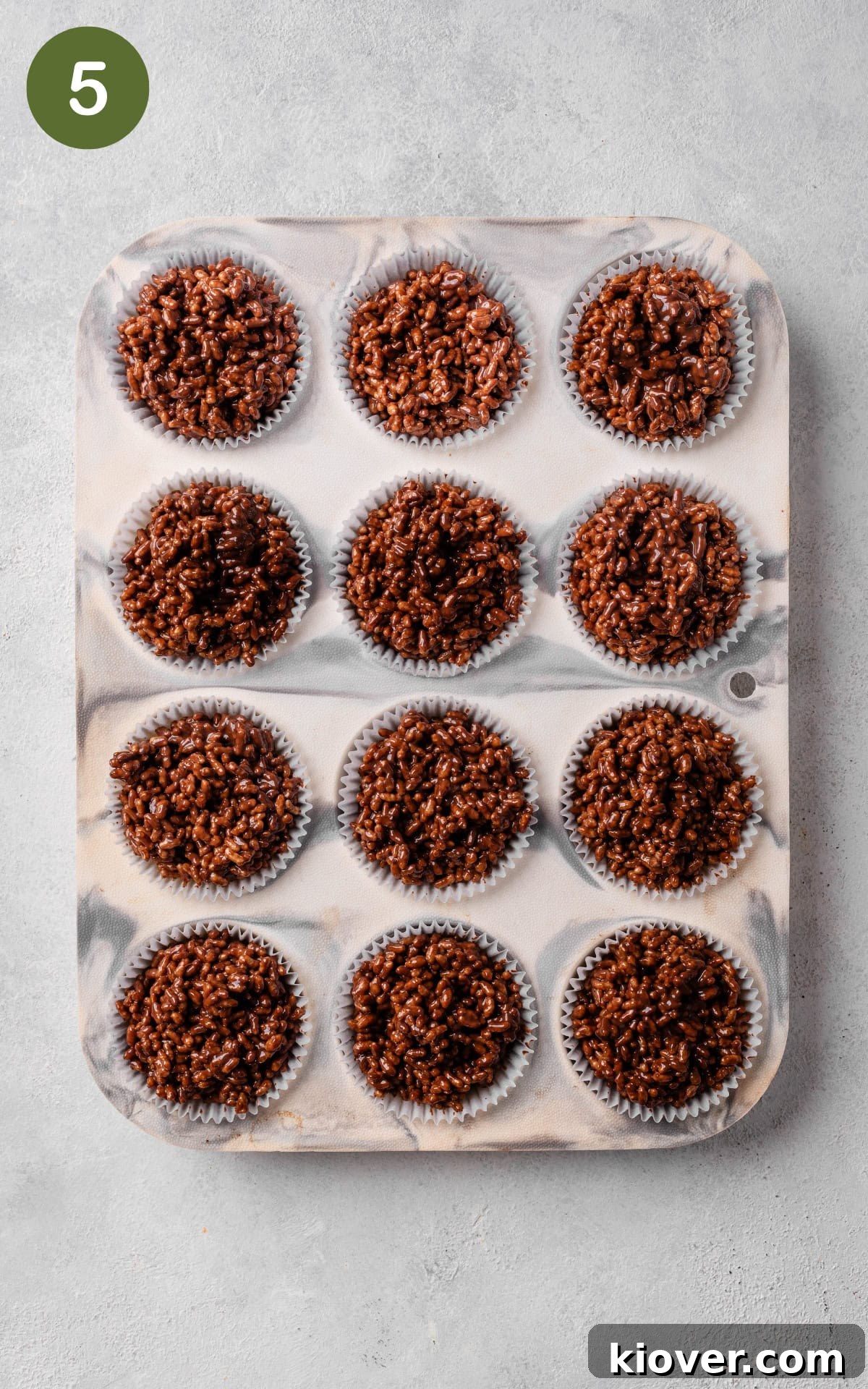 No-Bake Rice Krispie Treat Cakes Recipe for Parties and Gifts 8 paper liners filled with the prepared rice crispy mixture.