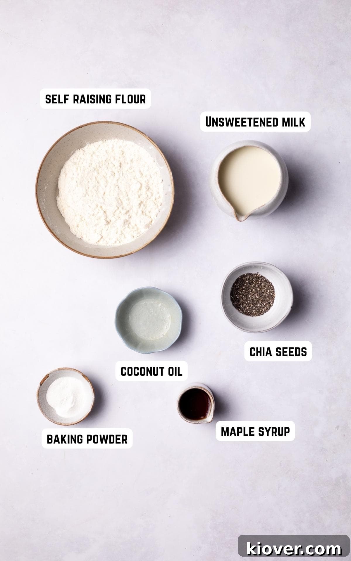 Fluffy Gluten-Free Pancake Recipe for Tender, Quick Breakfast 3 Ingredients to make Gluten Free Pancakes on a white marble background.