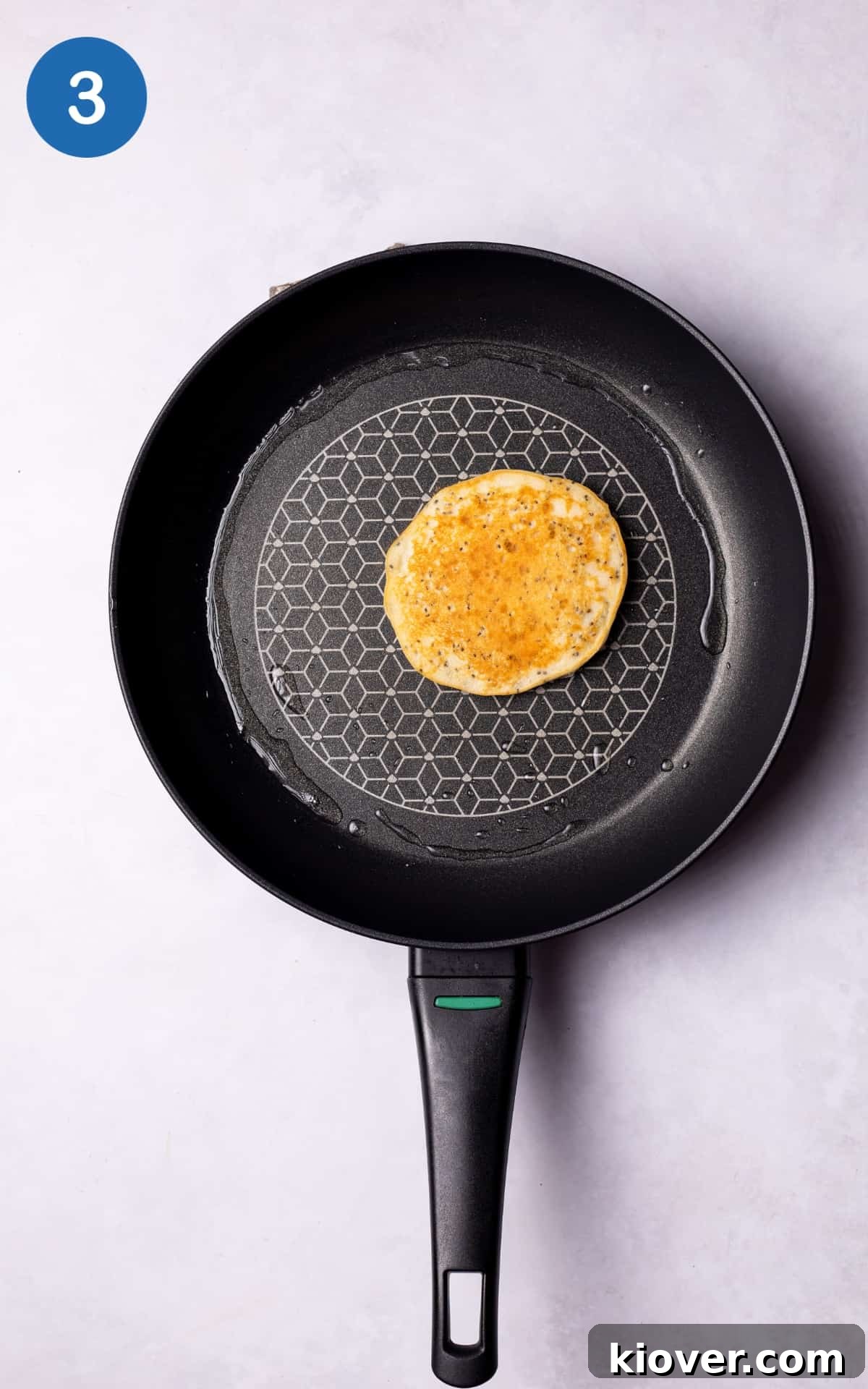 Fluffy Gluten-Free Pancake Recipe for Tender, Quick Breakfast 6 Lightly golden gluten free pancake in a pan.