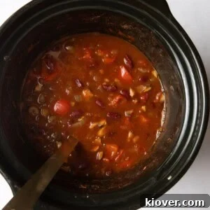 Slow Cooker Vegan Chili Recipe for Busy Weeknights 11 overhead shot of chilli with ladle in slow cooker