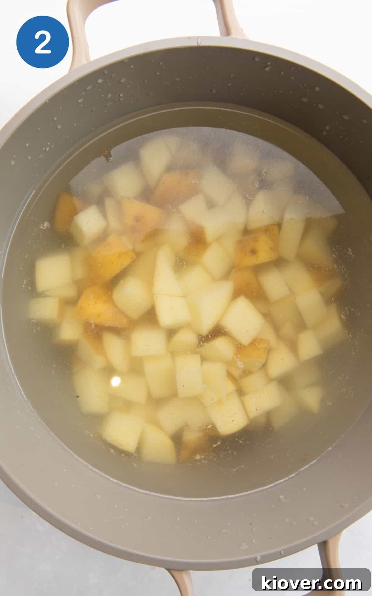 Crispy Potato Cakes Recipe: Fluffy Inside, Golden Outside 5 raw potatoes in a large pot of boiling water.