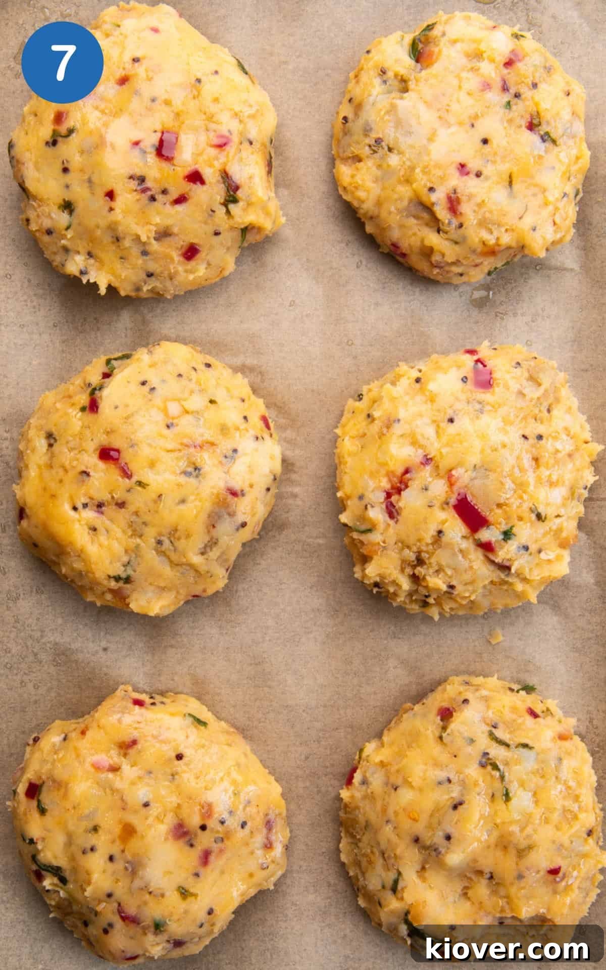 Crispy Potato Cakes Recipe: Fluffy Inside, Golden Outside 10 potato cakes on a baking tray.