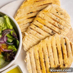3 gluten free flatbreads on white plate.