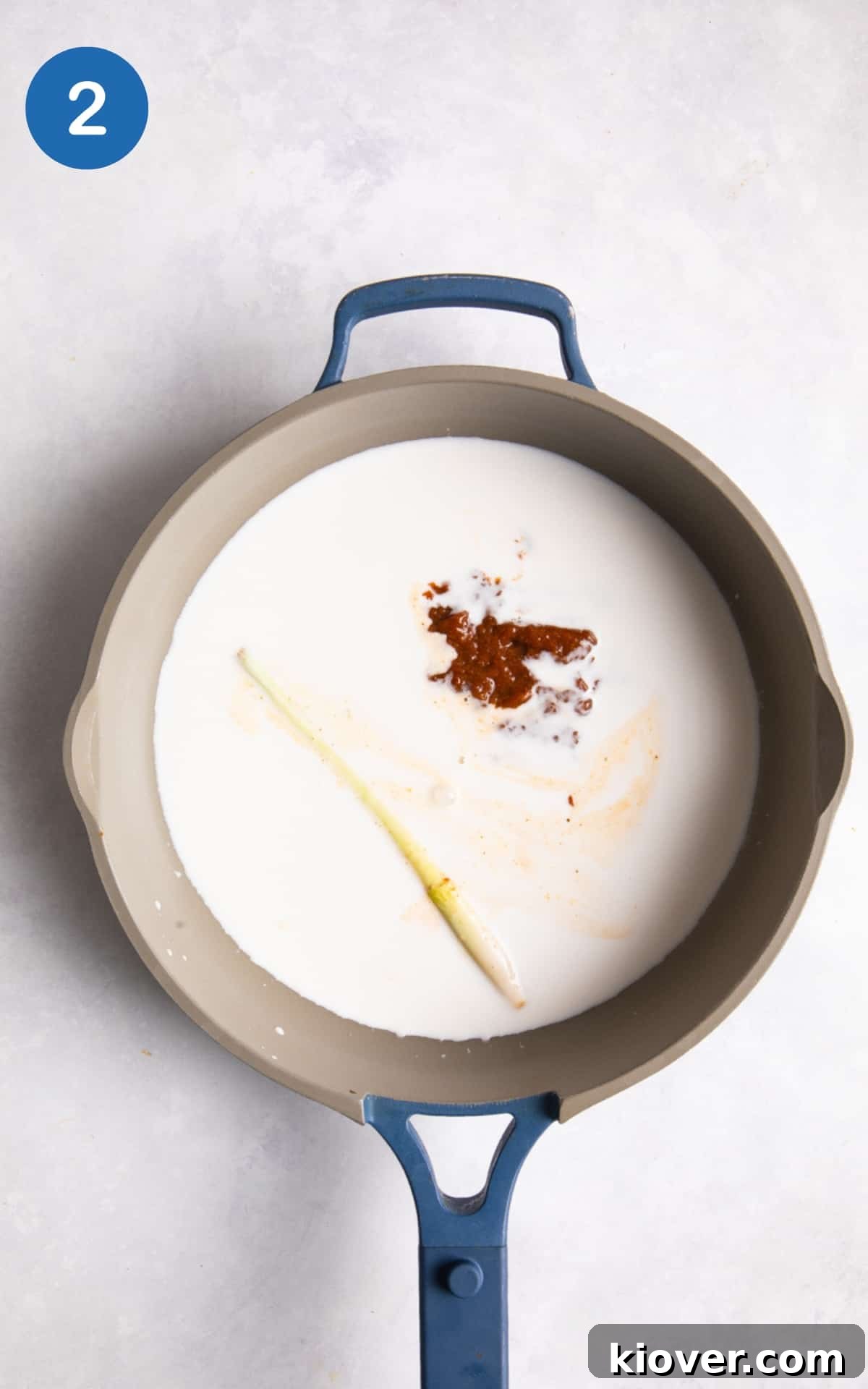 coconut milk, lemon grass and red curry paste in large shallow frying pan.