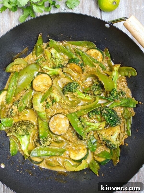 Vegetable Thai Green Curry in a wok.
