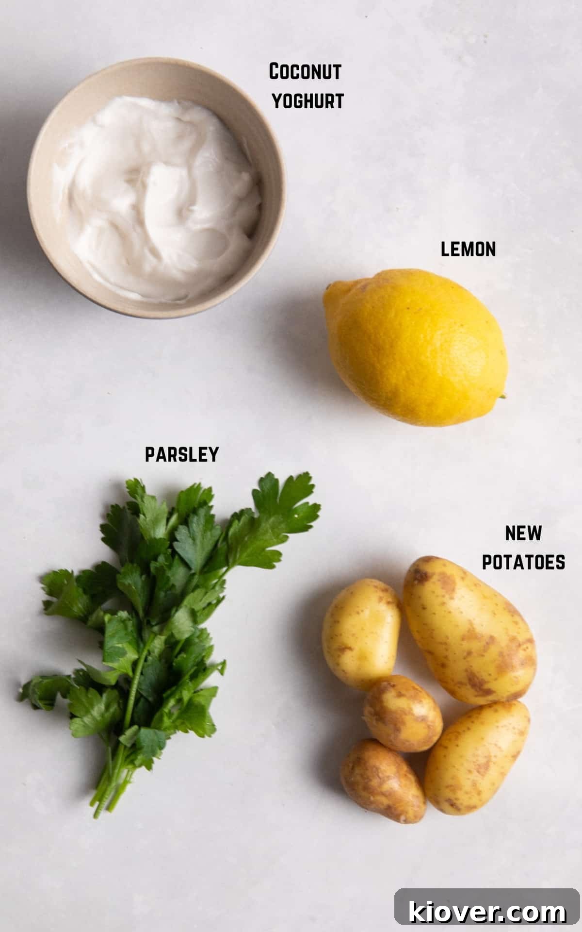 Creamy Yogurt Potato Salad with Fresh Herbs 3 ingredients to make potato salad on white surface.