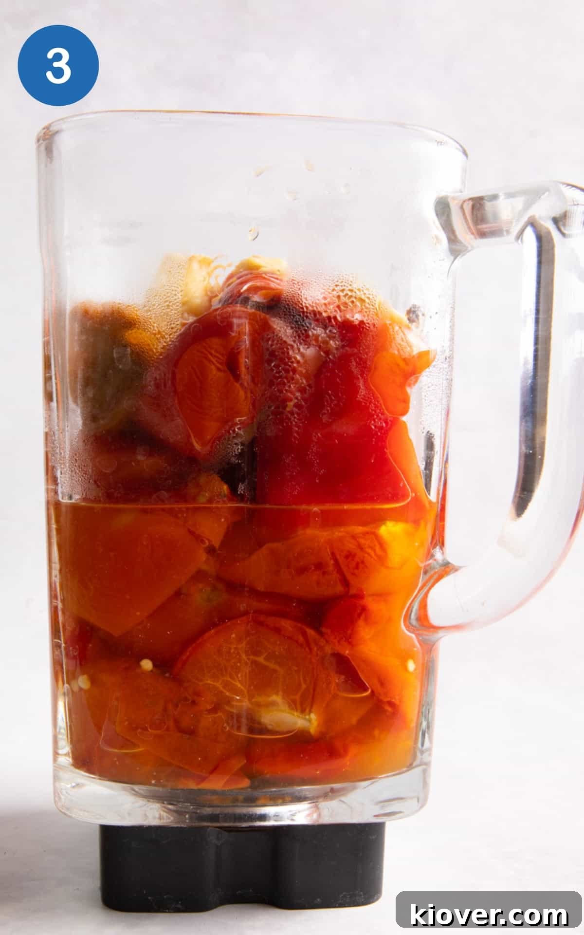 roasted tomatoes, pepper, garlic, onion and veg stock in a blender ready to blender.