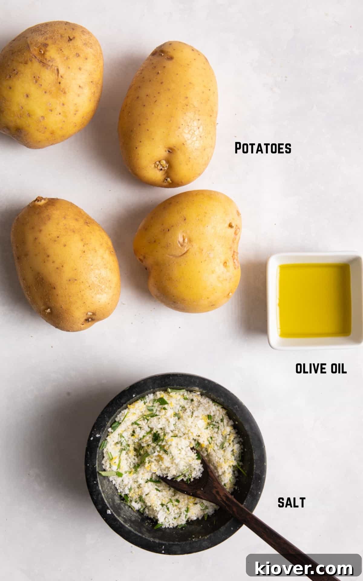 Crispy Air Fryer French Fries: Quick Homemade Recipe 3 Ingredients to make air fryer chips laid on white background.