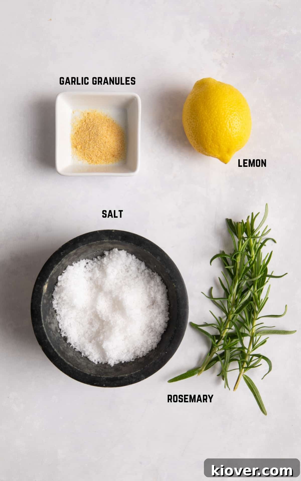 How to Make Homemade Rosemary Salt for Flavorful Cooking 3 Ingredients to make rosemary salt laid on white surface.