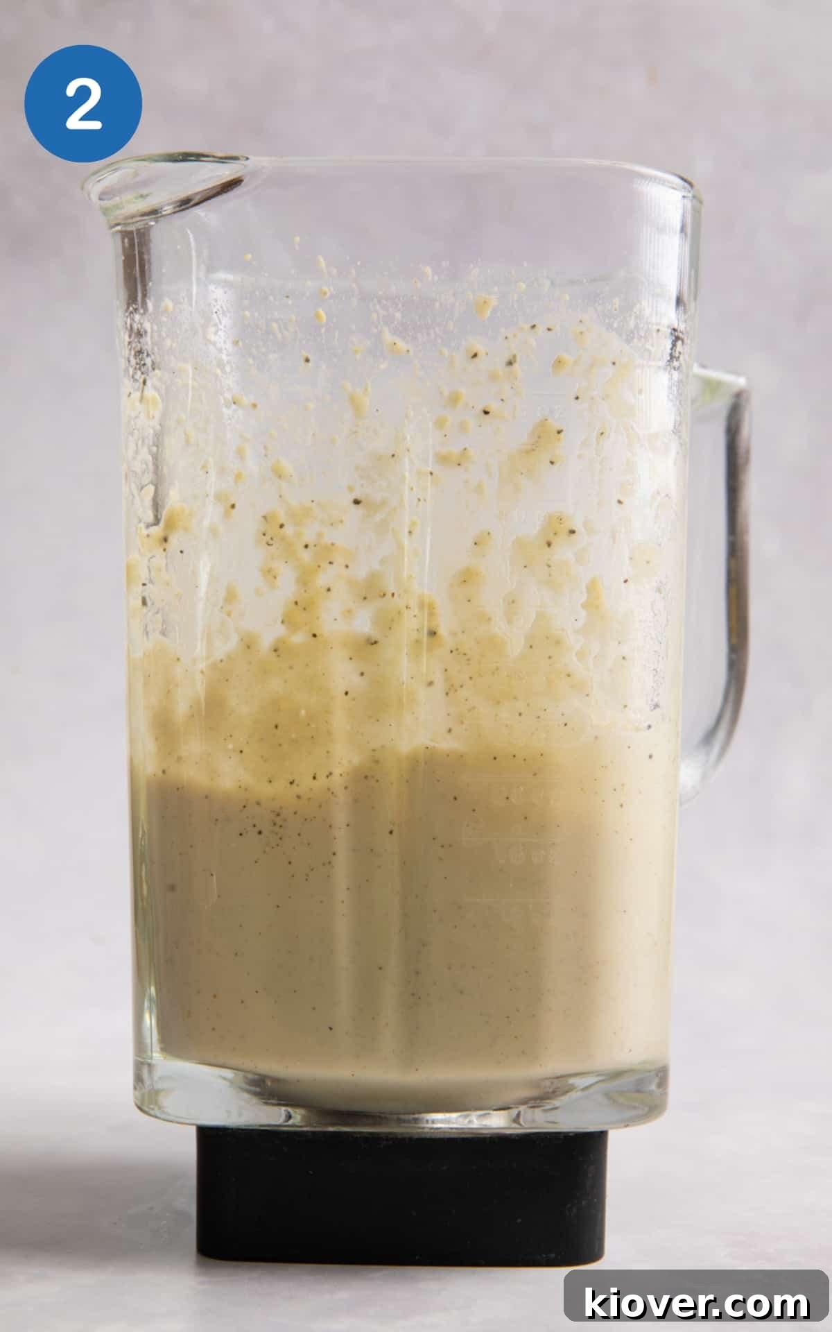 Creamy Vegan Béchamel Sauce Recipe for Pasta & Lasagna 5 white sauce in blender after having been blended.