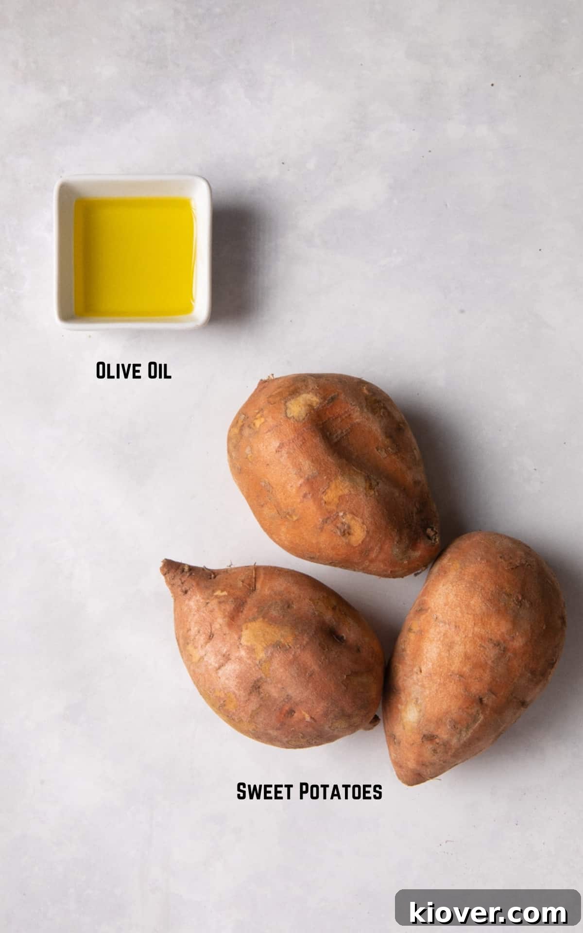 Ingredients to make the recipe on a white marble background.