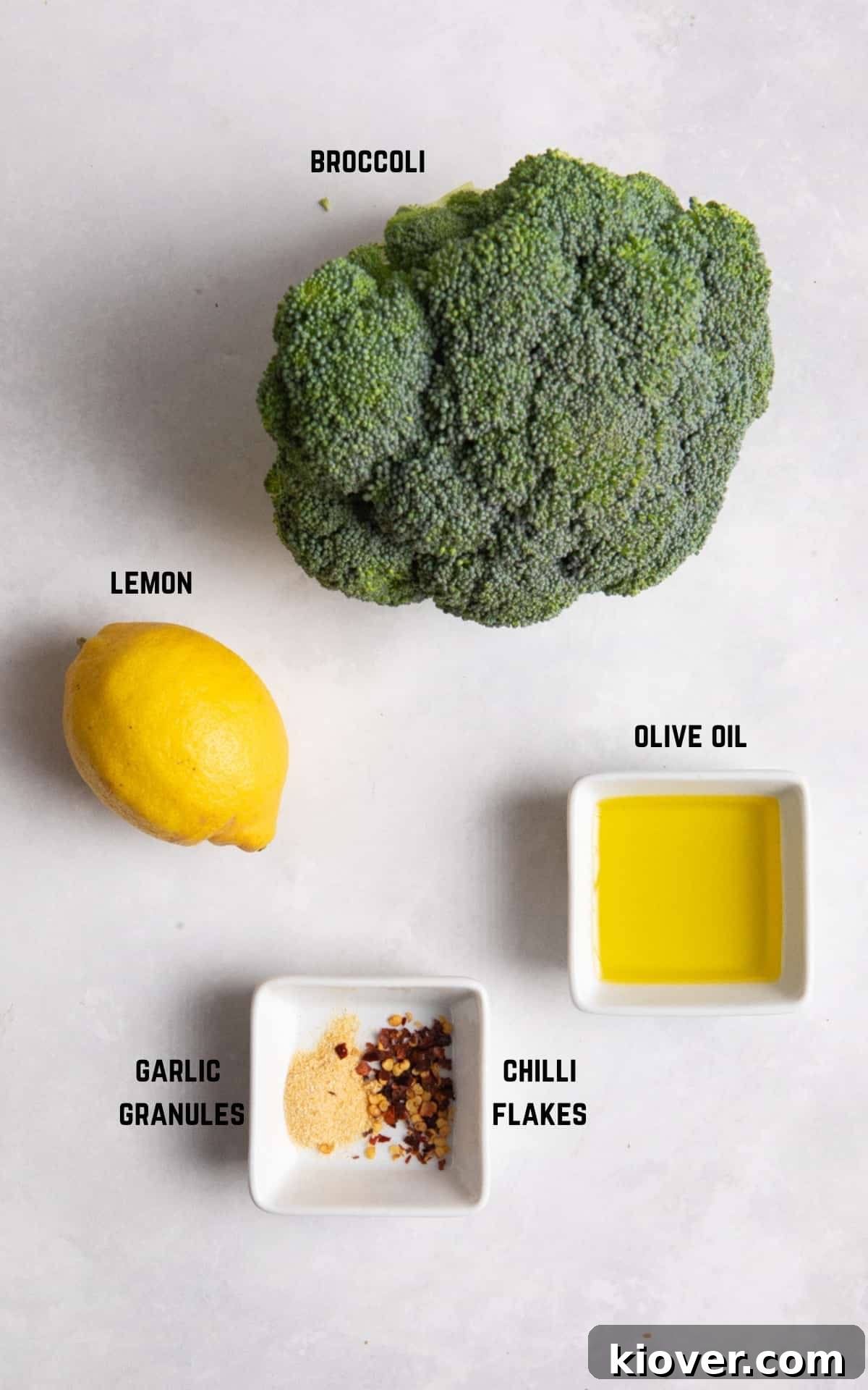 Crispy Air Fryer Broccoli Recipe — Quick Dinner Side 3 Ingredients to make air fryer broccoli on white surface.