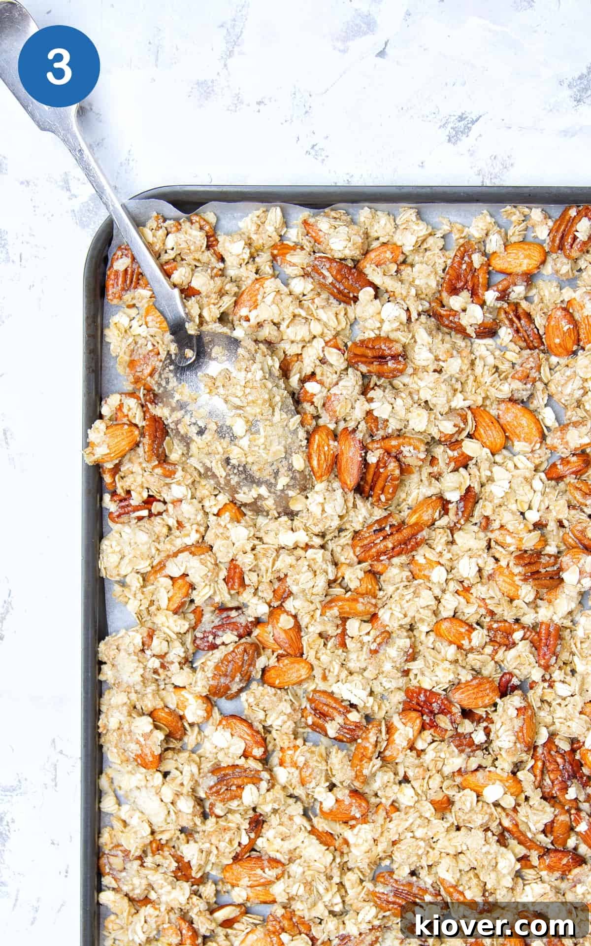 granola on a baking tray ready for the oven