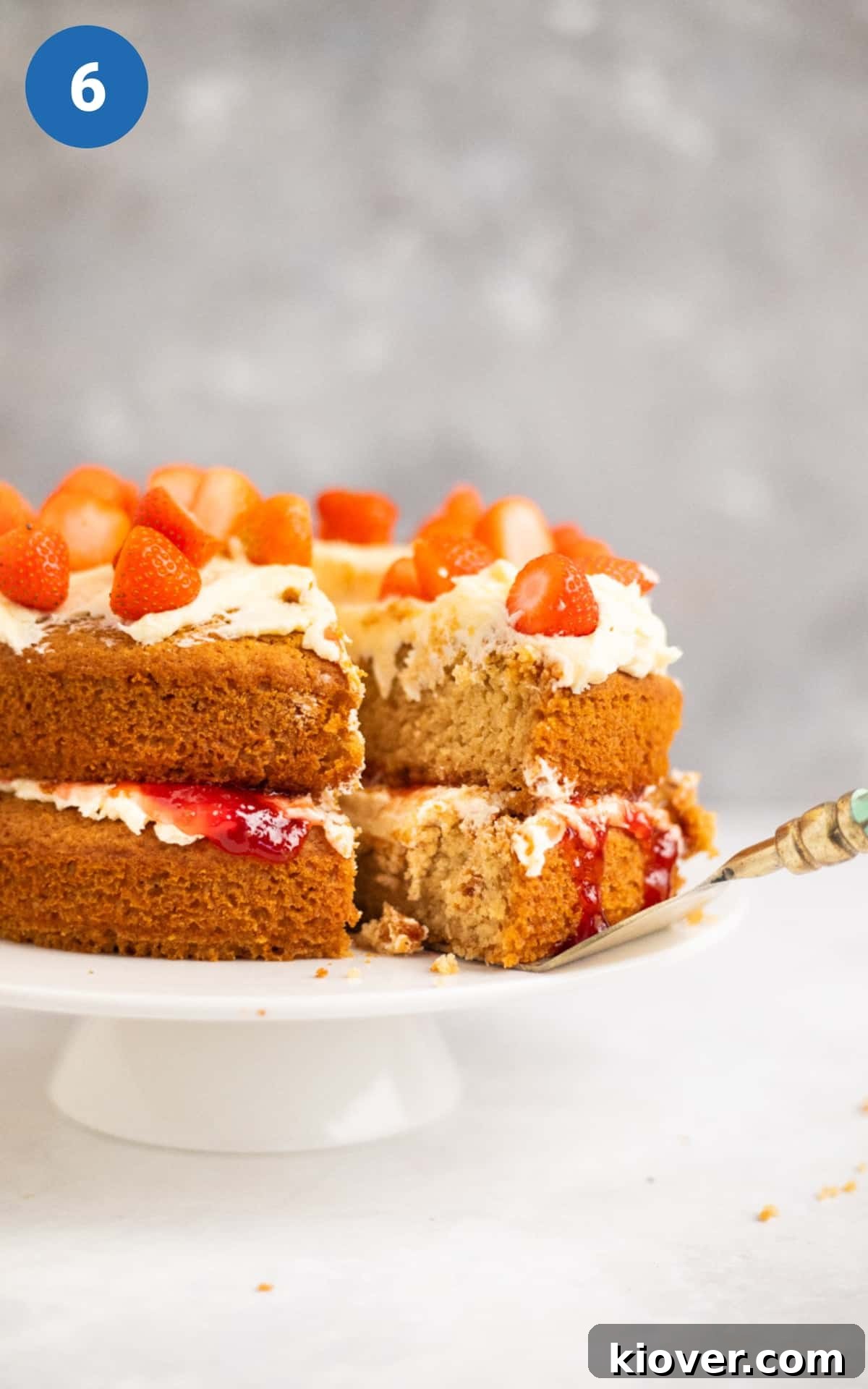 Gluten-Free Victoria Sponge Cake Recipe for Light, Fluffy Layers 9 Gluten Free Victoria Sponge topped with icing sugar and strawberries sliced