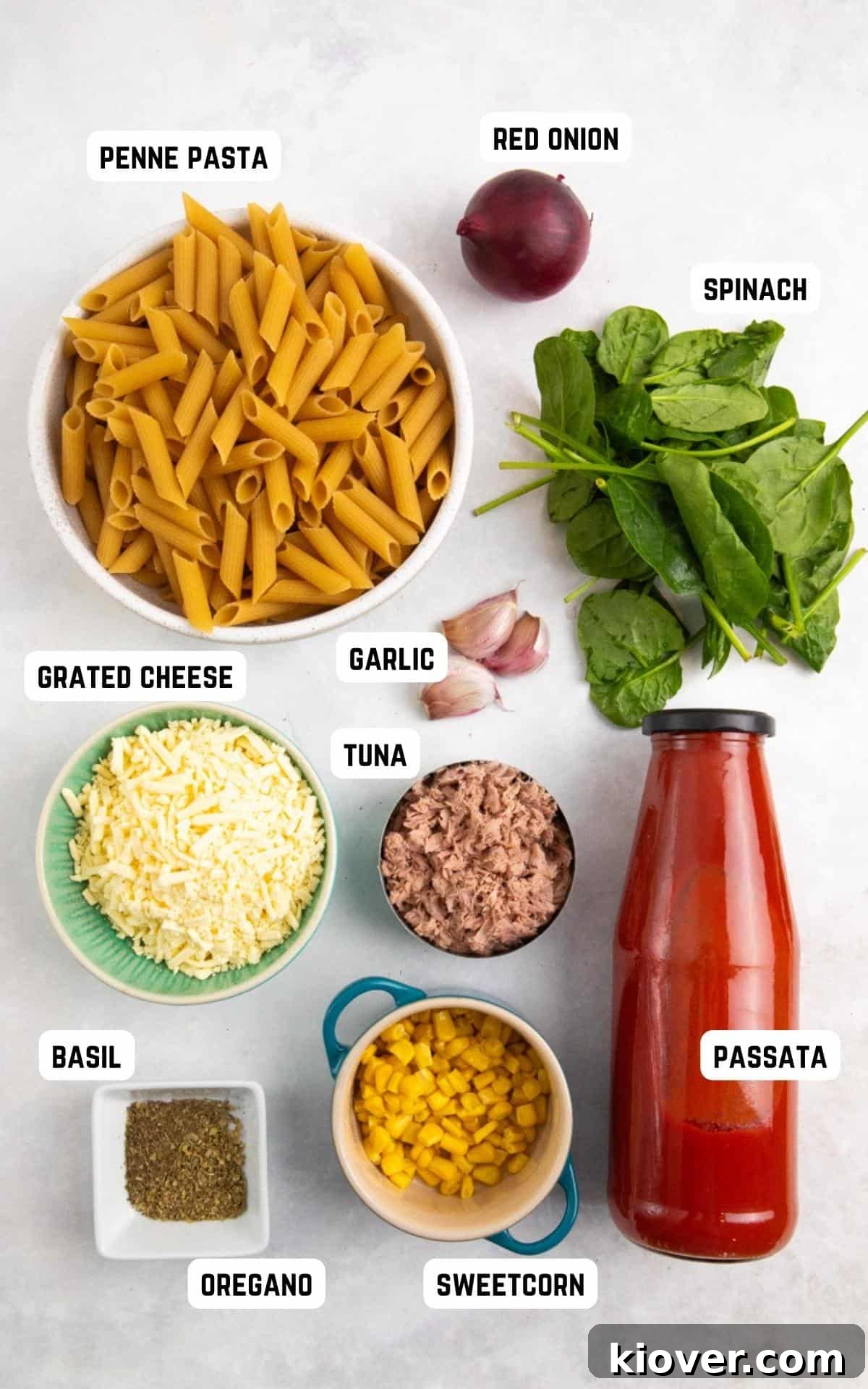 tuna pasta bake ingredients laid out on a white background.