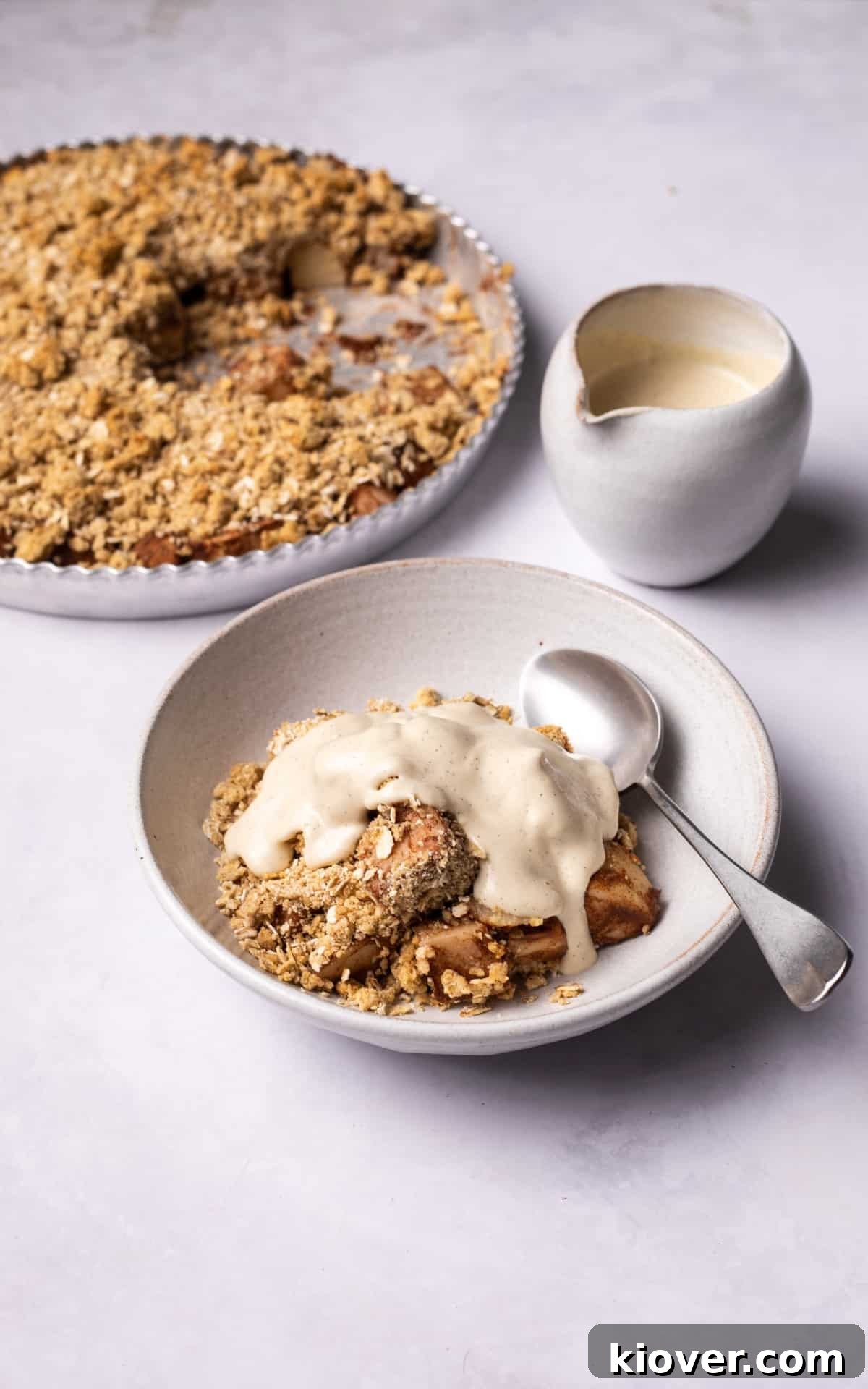 cashew cream on top of pear crumble. 