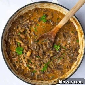 One-Pot Creamy Vegan Mushroom Stroganoff Recipe 13 mushroom stroganoff on large pan displayed on white background