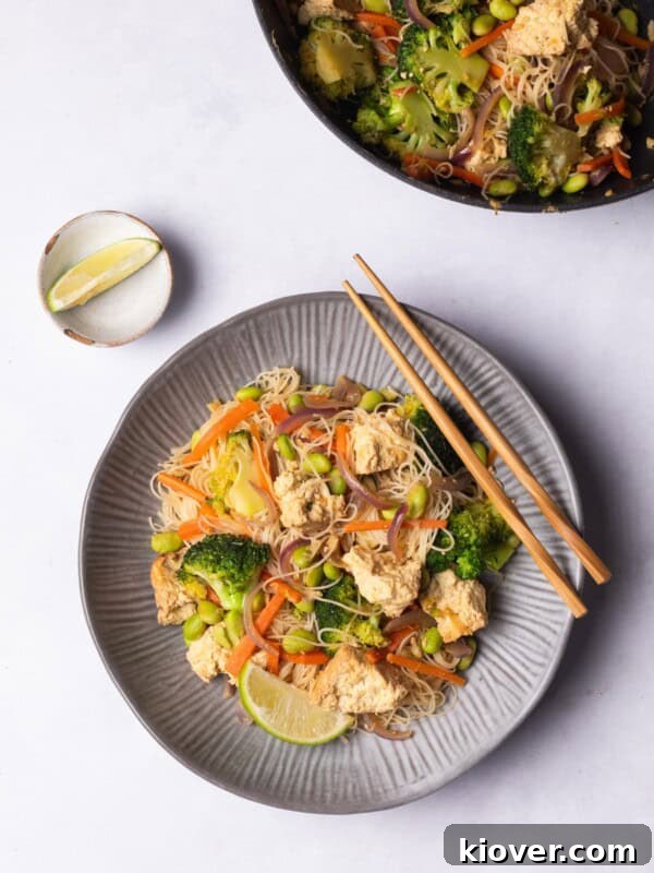 Creamy Vegan Laksa Recipe: Flavorful Plant-Based Coconut Curry Soup 13 Vermicelli Noodles with vegetables and tofu.