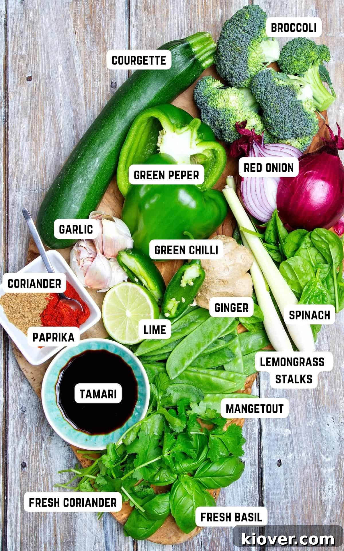 Ingredients to make Vegetable Thai Green Curry on a wooden table.