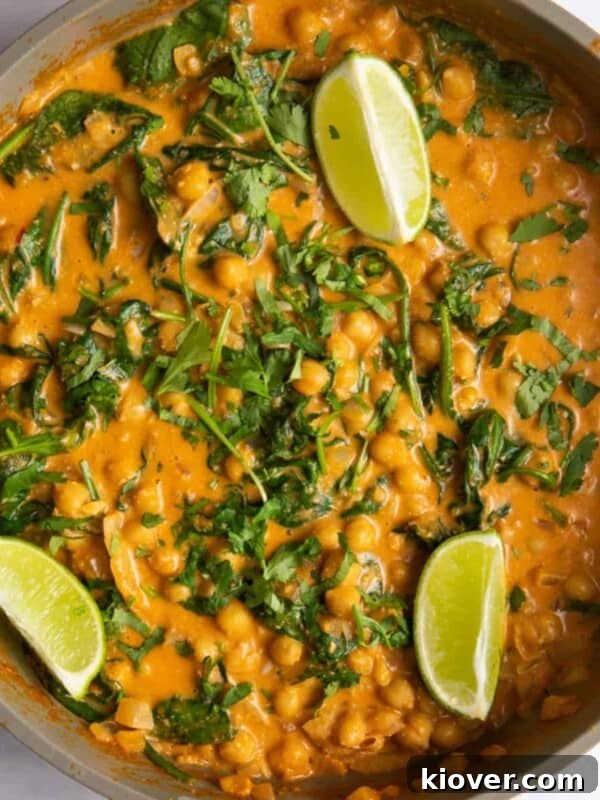 chickpea curry topped with fresh lime wedges.