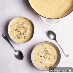 Creamy Roasted Parsnip Soup Recipe with Garlic and Thyme 12 Parsnip soup with sunflower seeds served in bowls.