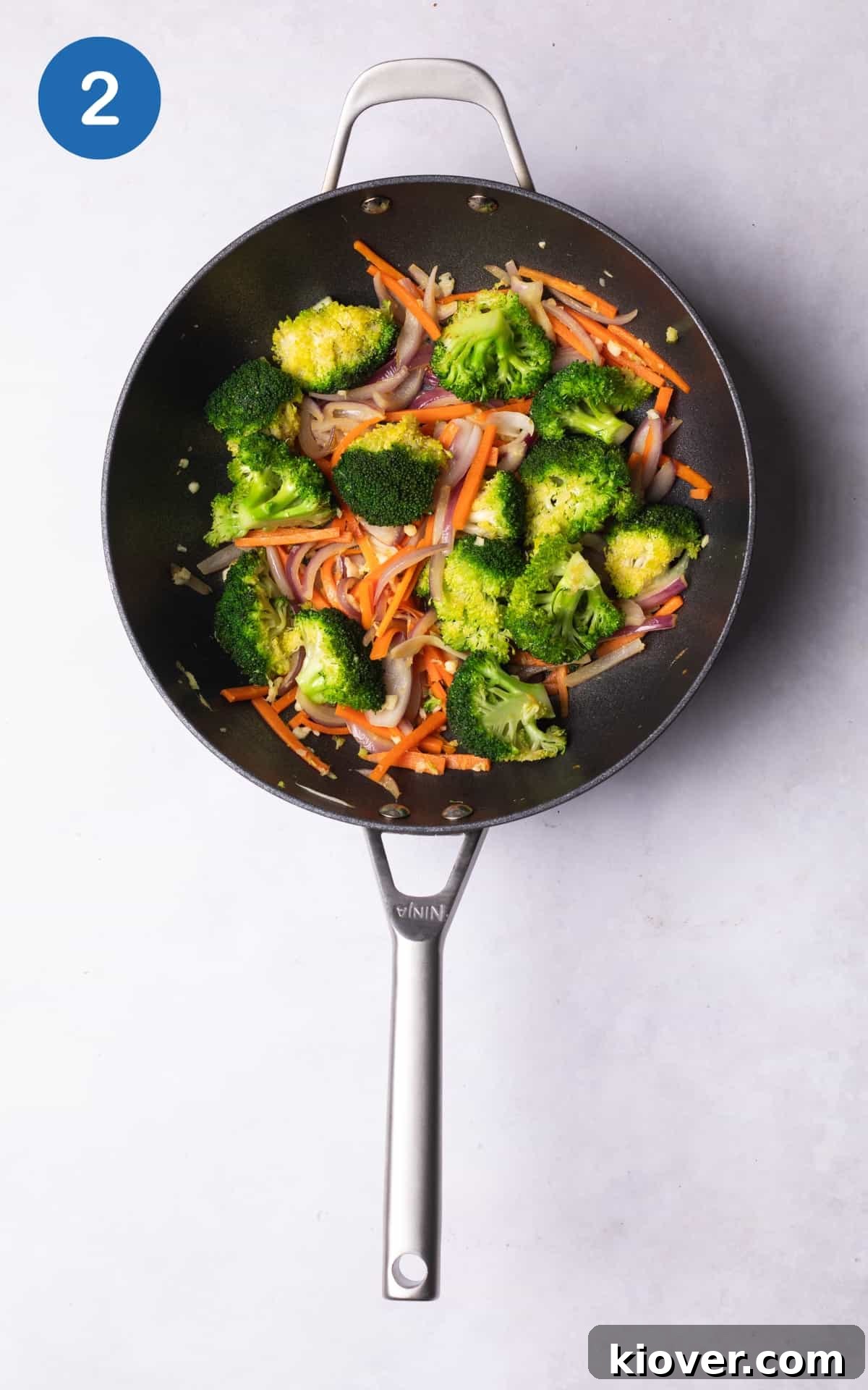 chopped vegetables, garlic and ginger in a wok.