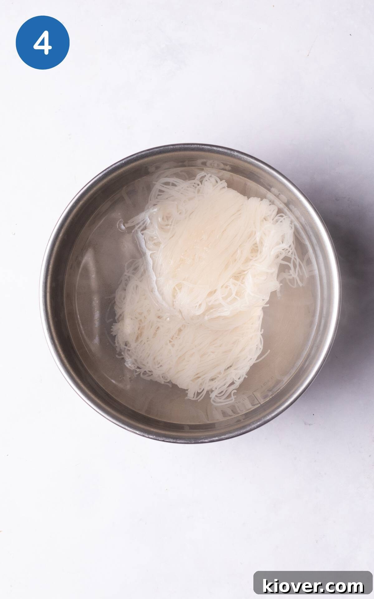 vermicelli noodles covered in boiling water.