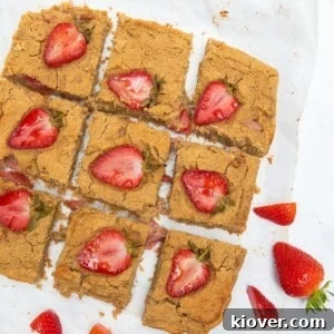 Peanut Butter Blondies with strawberries on top.