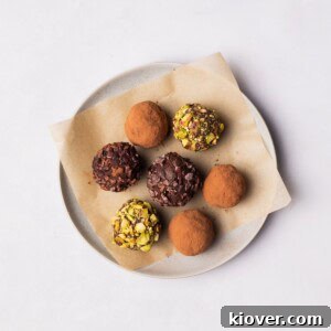 Vegan Chocolate Truffles on a plate with different toppings.