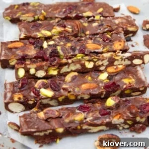 Vegan rocky road in slices on parchment paper.