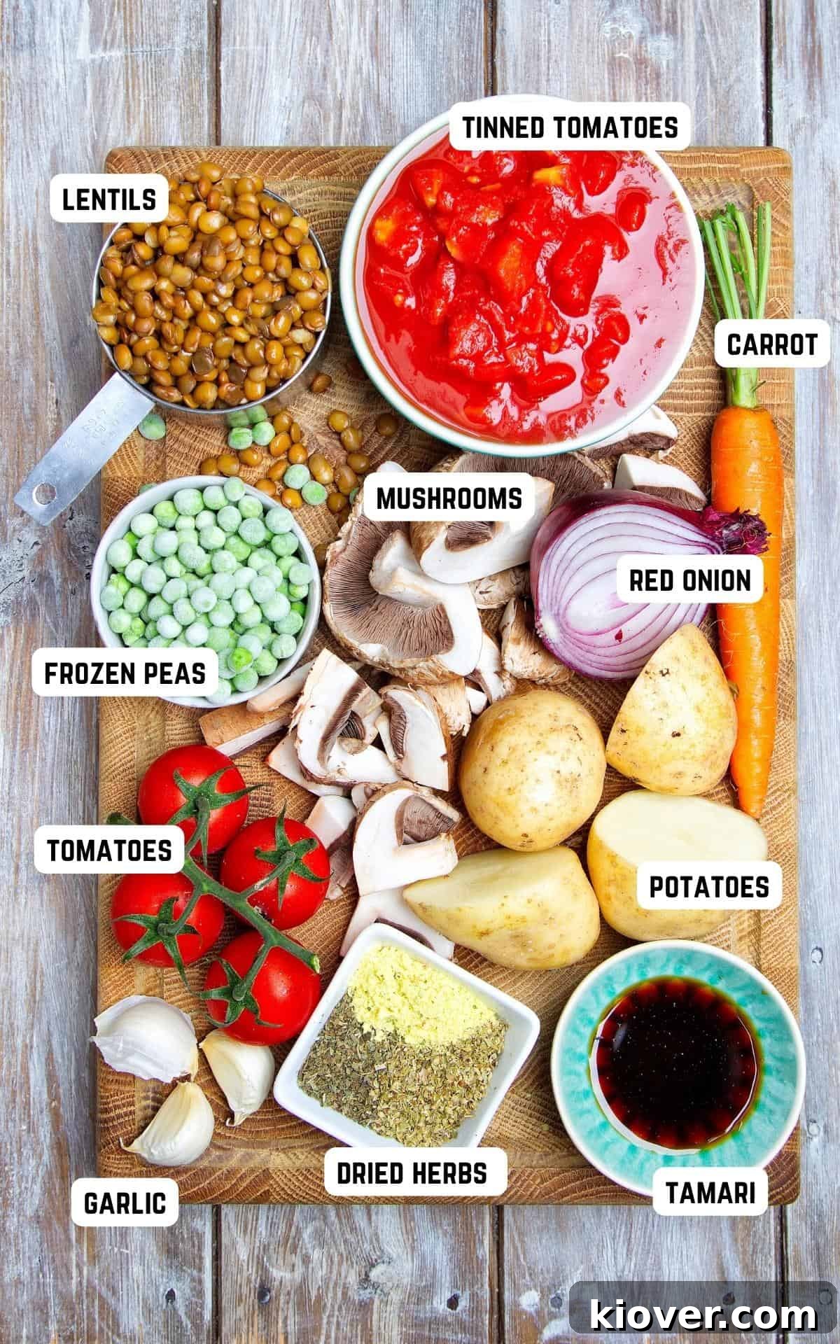 Ingredients to make Vegan Shepherd's Pie on a wooden board.