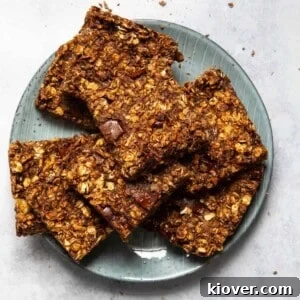 35 Delicious Gluten-Free Desserts for Every Occasion 6 5 ingredient chocolate flapjacks sliced and stacked on a blue plate.