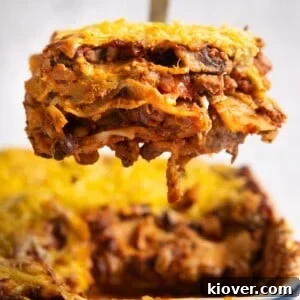 71 Top Gluten-Free Recipes for Every Meal 24 lasagne slice being lifted from baking dish full of lasagne.