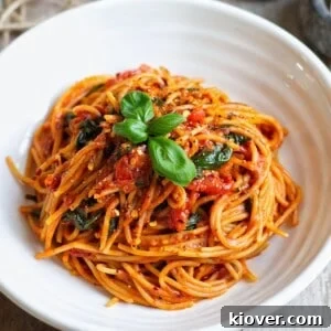 71 Top Gluten-Free Recipes for Every Meal 29 Cherry Tomato Pasta with fresh basil leaves on top.