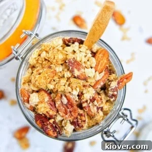 71 Top Gluten-Free Recipes for Every Meal 4 peanut butter granola in a large glass jar with wooden spoon