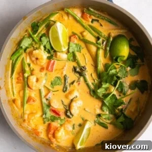 71 Top Gluten-Free Recipes for Every Meal 33 overhead shot of Thai red prawn curry in large shallow frying pan.
