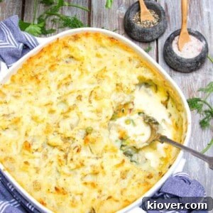 71 Top Gluten-Free Recipes for Every Meal 35 dairy free fish pie served in a white baking dish with a silver spoon.