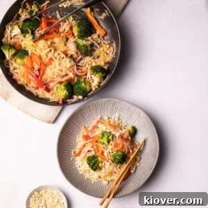 71 Top Gluten-Free Recipes for Every Meal 42 Vegan Pad Thai served in a plate next to a pan on the table.
