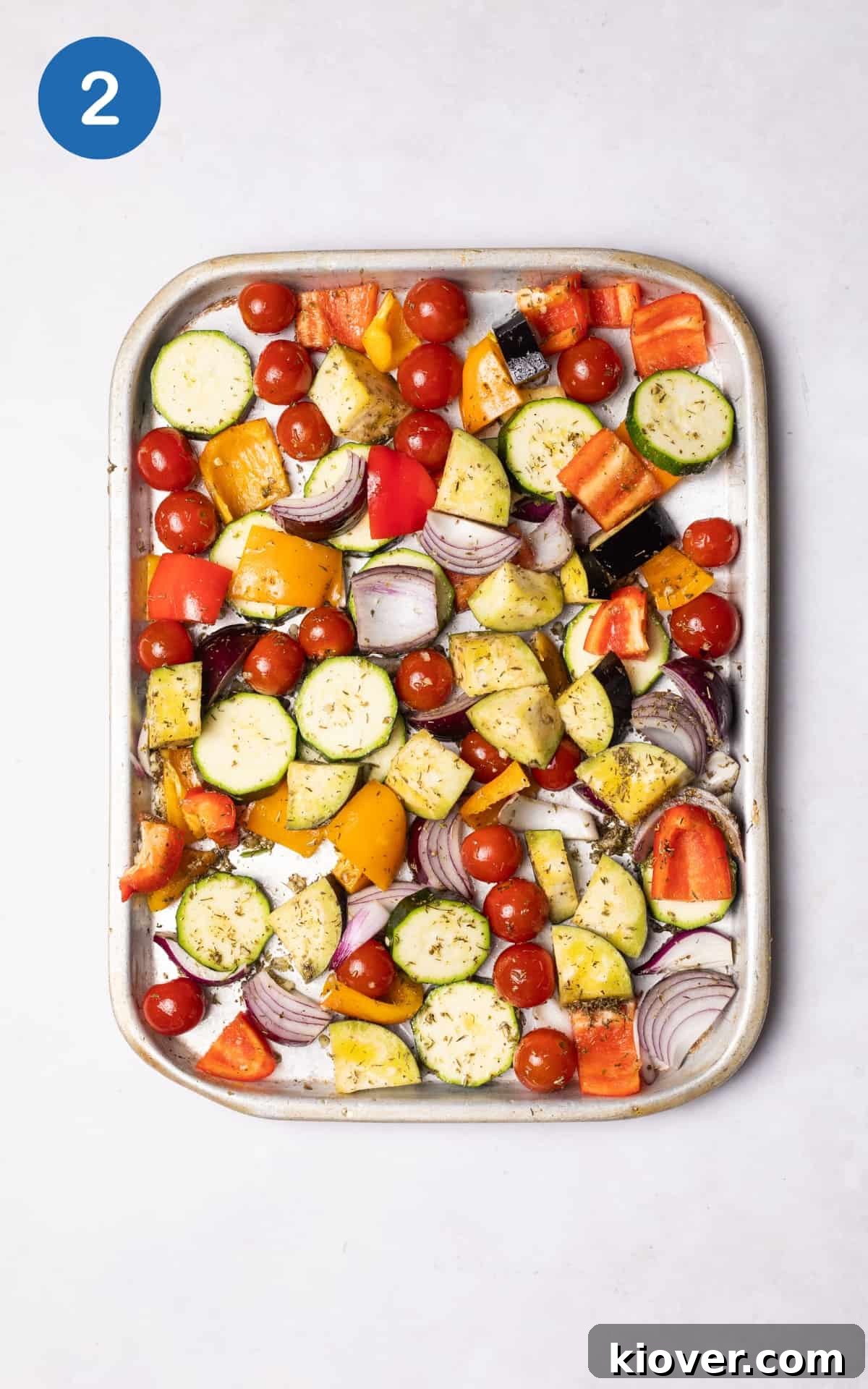 Mediterranean Roasted Vegetables Recipe for Flavorful Sides 5 colourful vegetables on a baking tray.