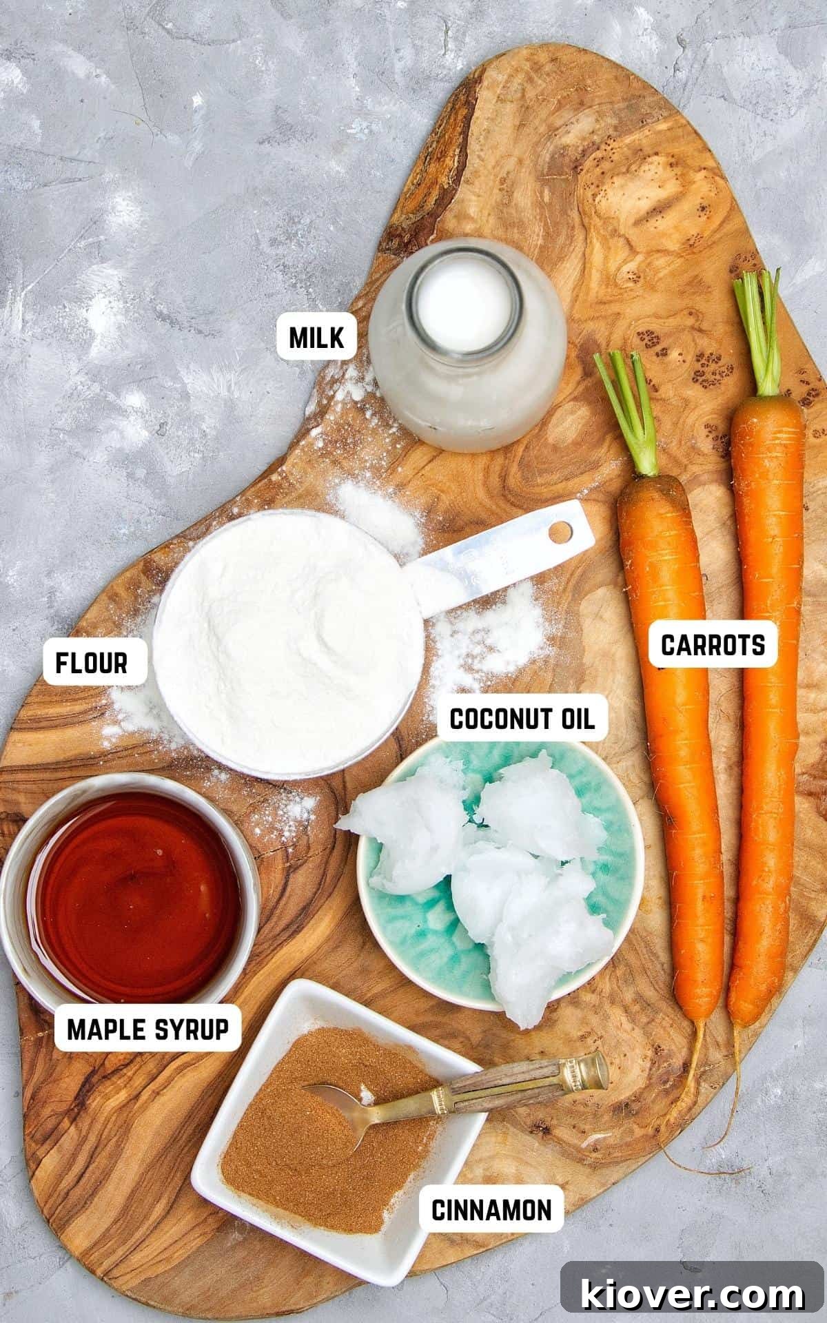 Moist Vegan Carrot Cake Cupcakes with Creamy Frosting 3 Ingredients to make Vegan Carrot Cake Cupcakes on a wooden chopping board.