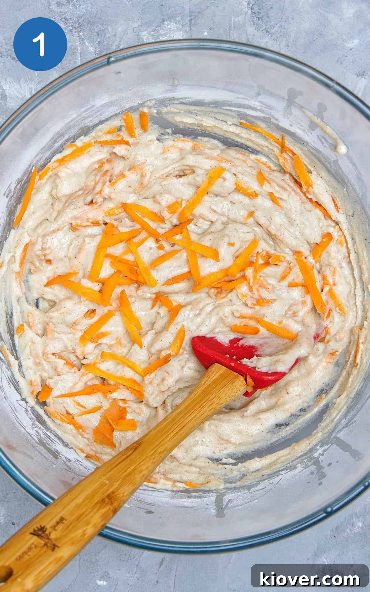 Moist Vegan Carrot Cake Cupcakes with Creamy Frosting 4 Ingredients to make Vegan Carrot Cake Cupcakes combined in a glass bowl.
