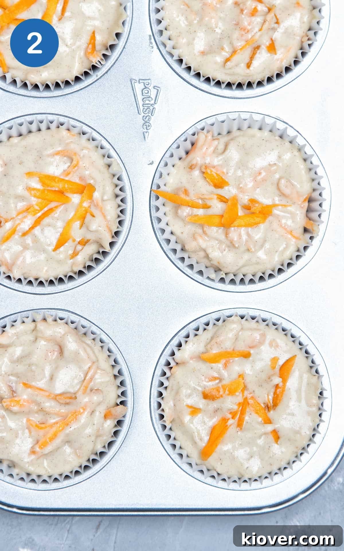 Moist Vegan Carrot Cake Cupcakes with Creamy Frosting 5 Mixture for Vegan Carrot Cake Cupcakes poured in cupcake liners.