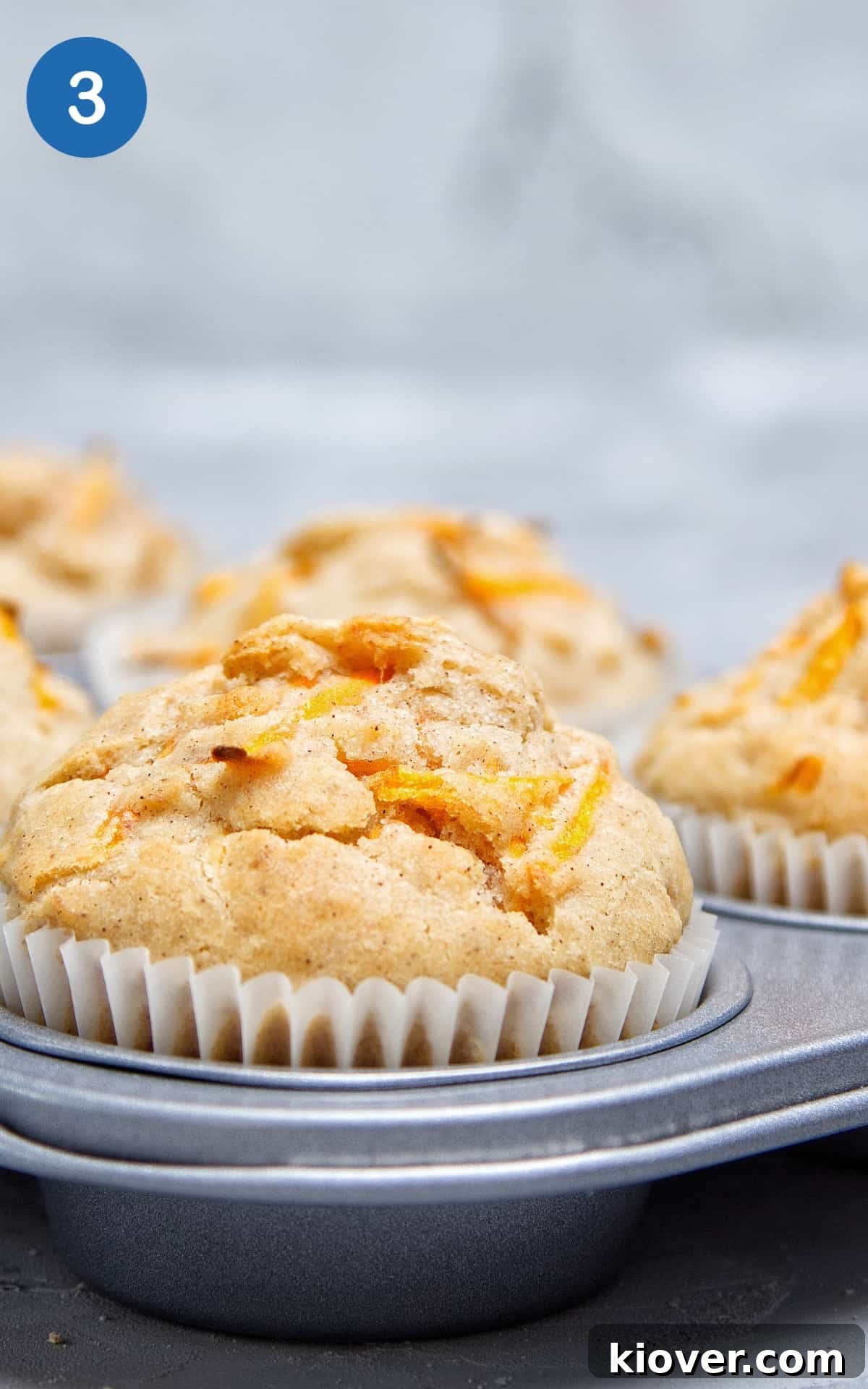Moist Vegan Carrot Cake Cupcakes with Creamy Frosting 6 Vegan Carrot Cake Cupcakes in a baking tray.