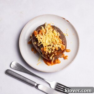 Crispy Air Fryer Jacket Potato Recipe for Perfect Baked Potatoes 11 Air Fryer Jacket Potato topped with beans and cheese.