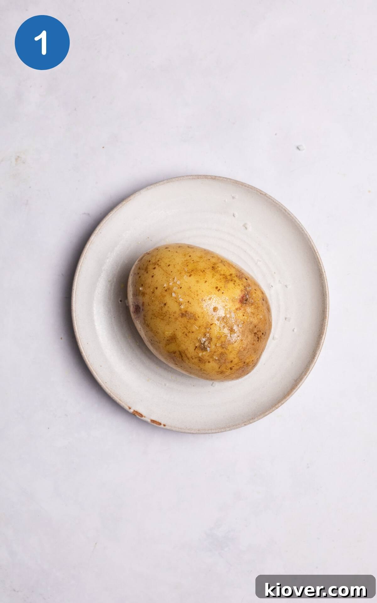 Crispy Air Fryer Jacket Potato Recipe for Perfect Baked Potatoes 4 potato rubbed with olive oil and salt.
