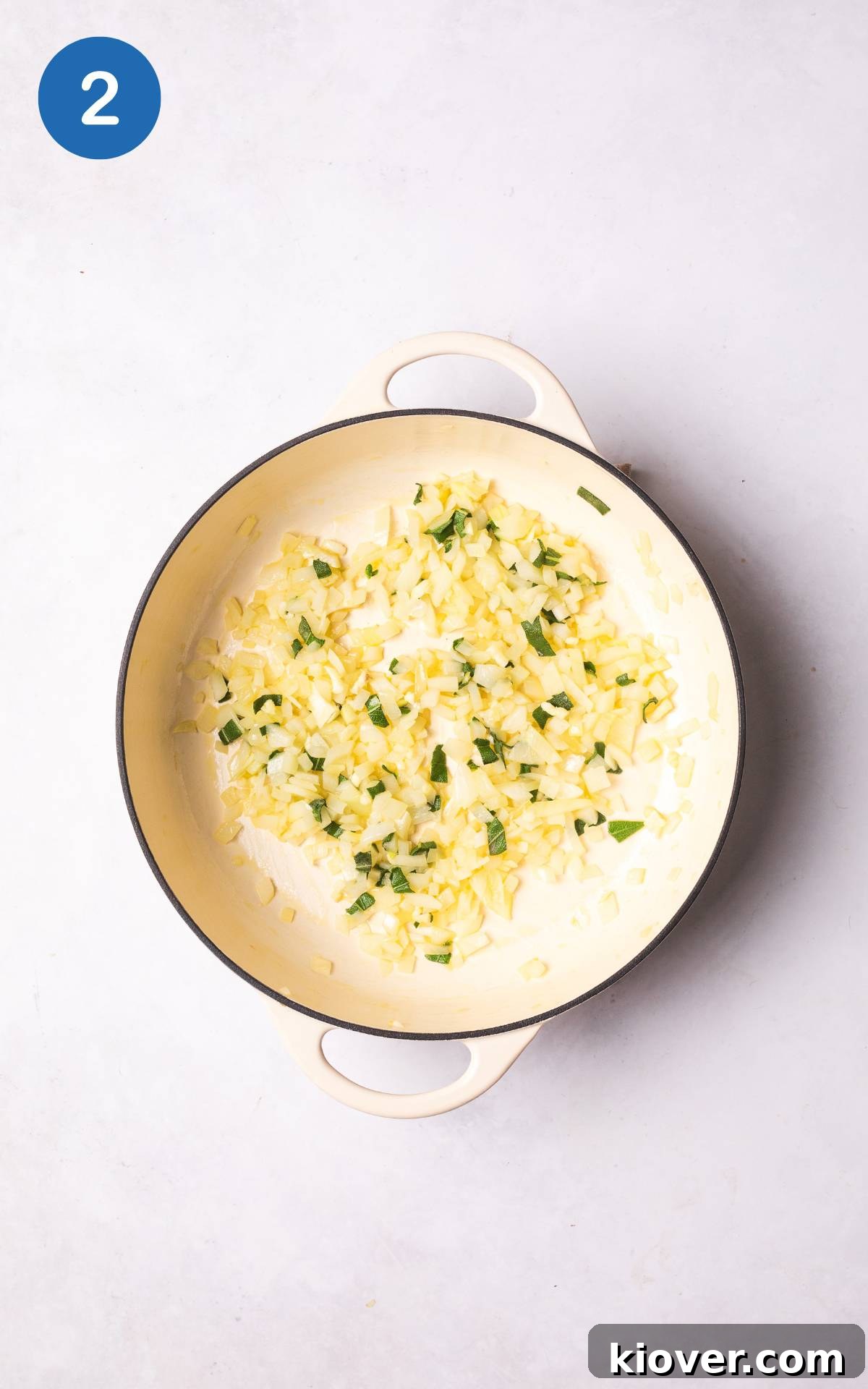 cooking onion and garlic in a pot.