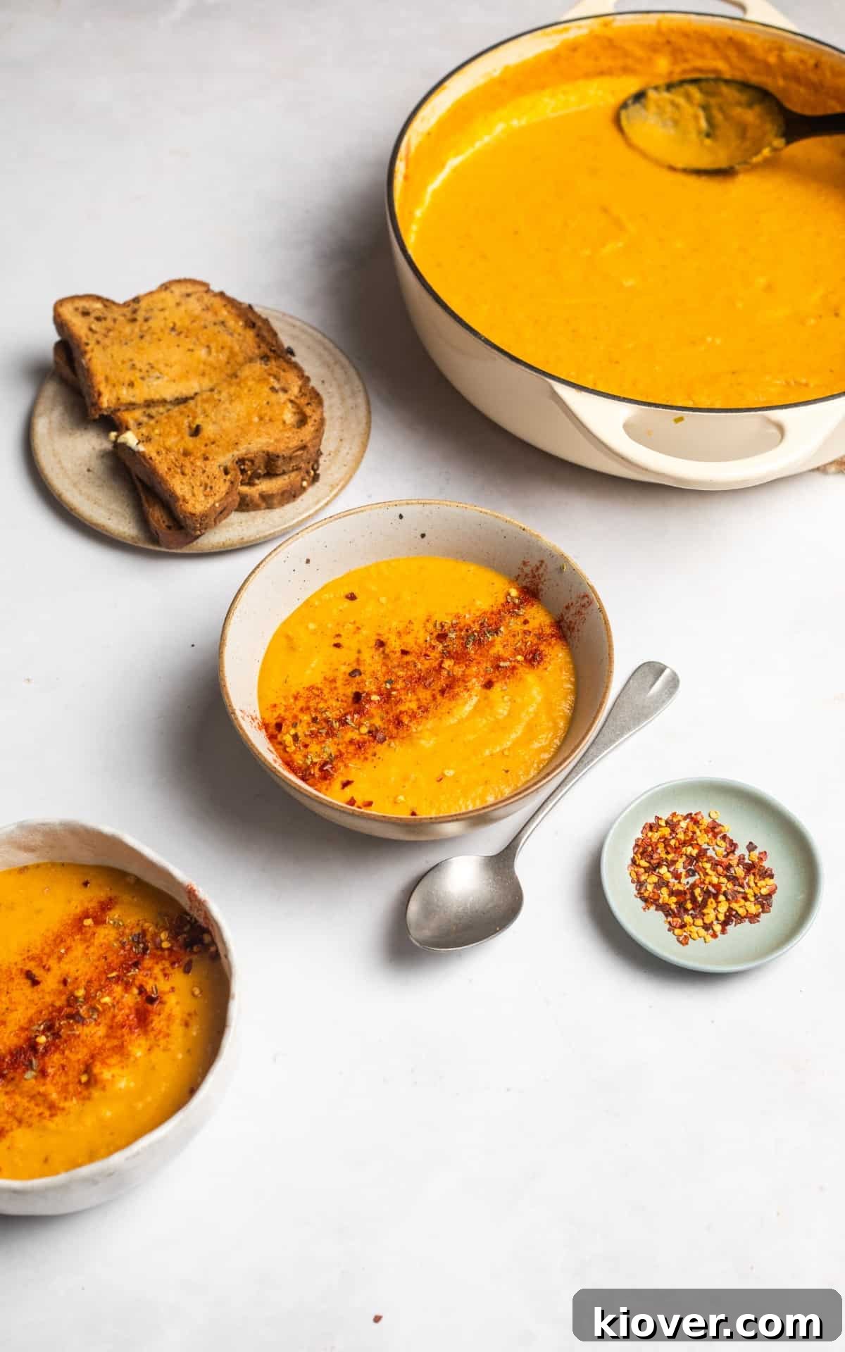 Hearty Carrot and Red Lentil Soup with Warm Spices 9 vegan and gluten free carrot and lentil soup garnished with smoked paprika and chilli flakes.